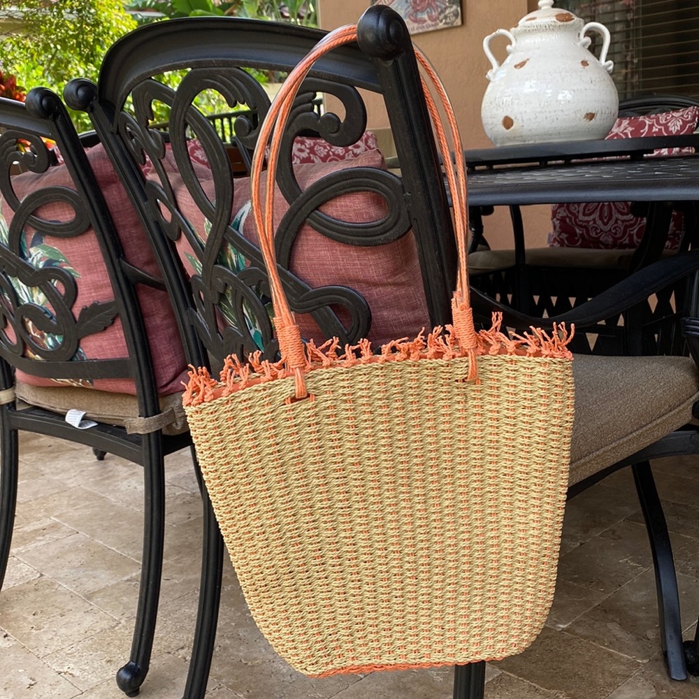 Weave tote with peach accents, snap closure and inside pocket